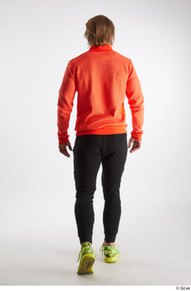 Erling  1 back view black pants dressed orange long…